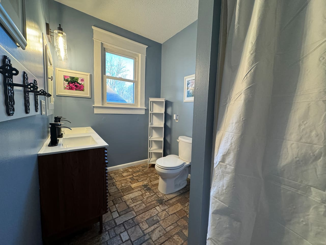 Upper Level Bathroom - Spacious double vanity and walk-in shower.