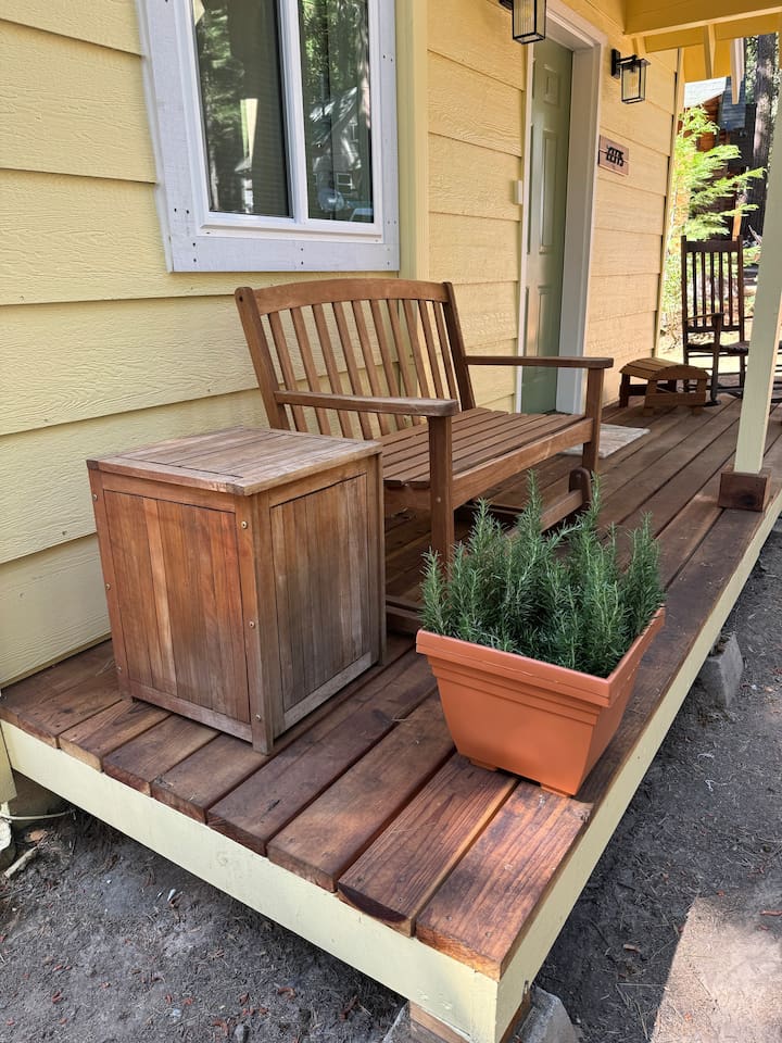 Curl up and read or drink your favorite beverage on the porch glider or rocker. There is a great space right out front to set up our cornhole or ladder ball sets too. 