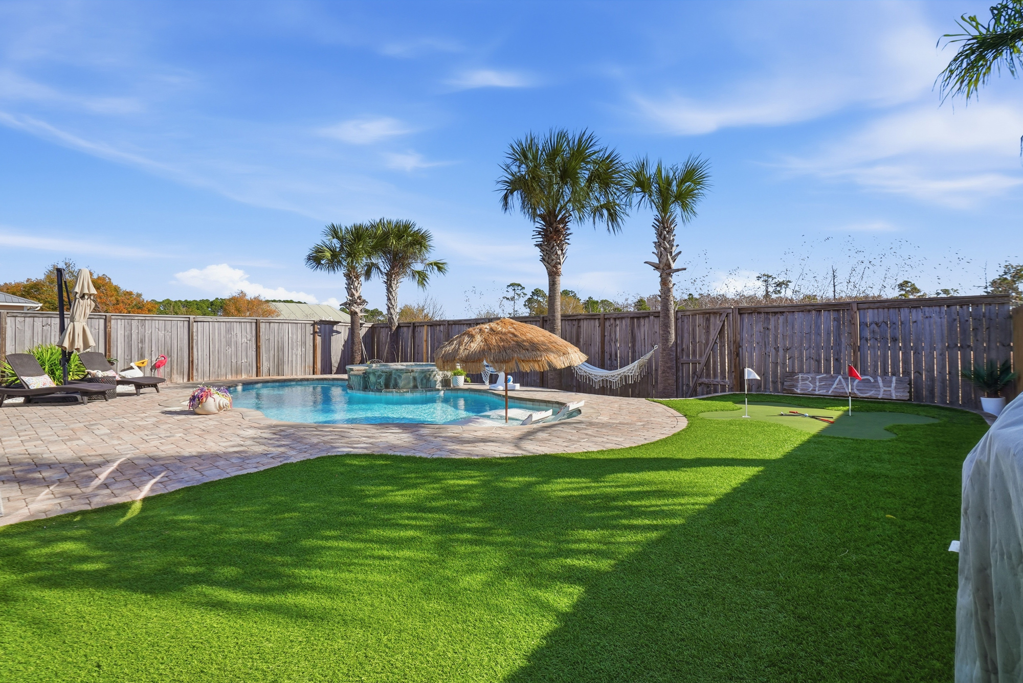 Private backyard putting green at this pet-friendly Panama City Beach vacation rental close to the beach.
