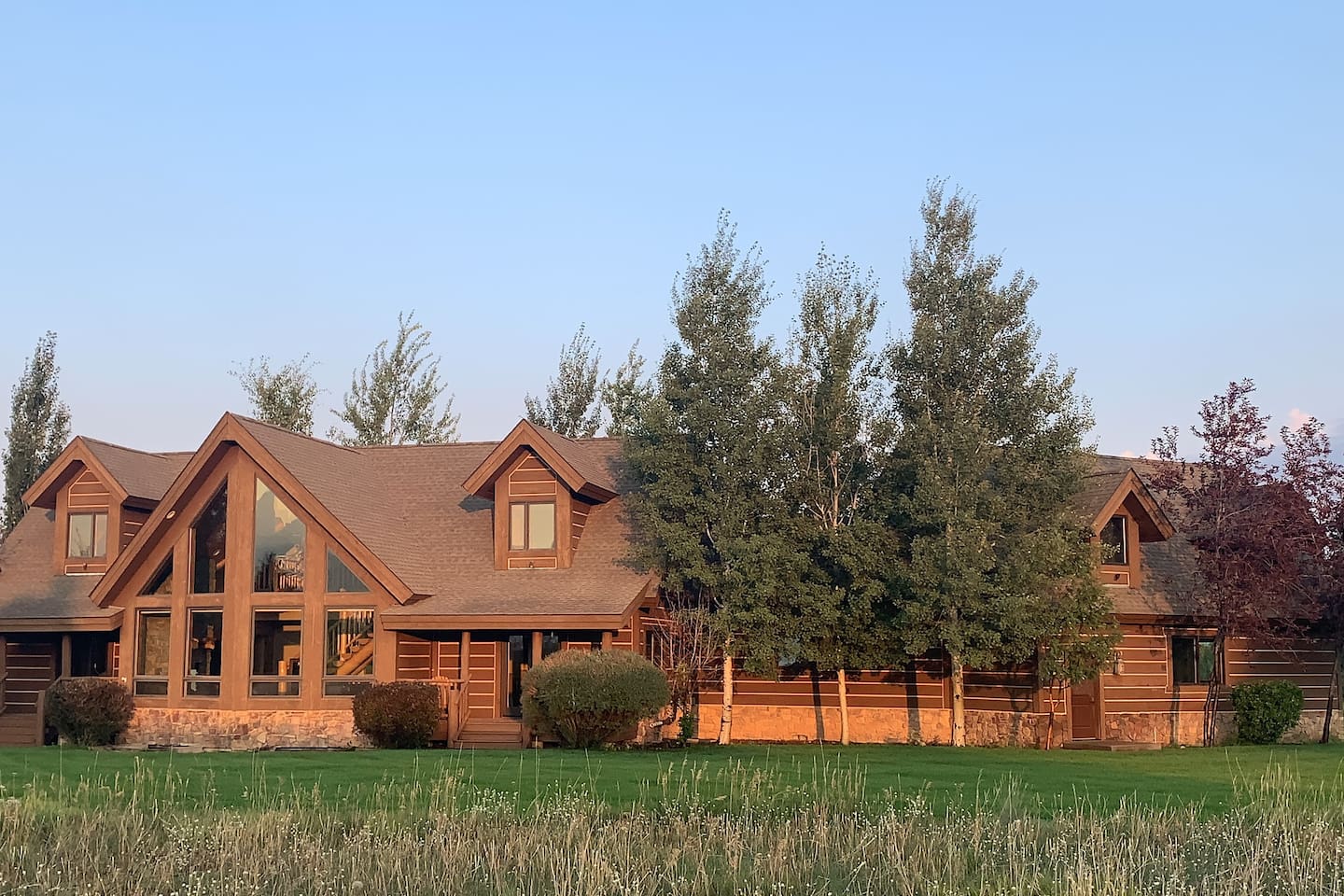 Enjoy wide-open space and fresh air at this beautiful A-frame retreat—perfect for outdoor games, group activities, and making memories on the expansive lawn. The yard faces the Tetons for amazing views!   A bit of corn-hole anyone?  