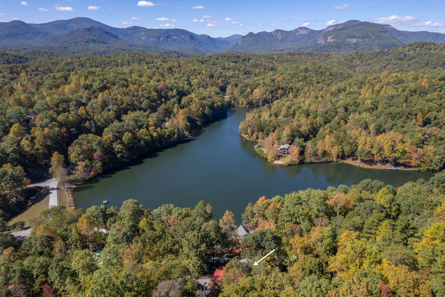 Aerial view of lake and Rumbling Bald mountain
