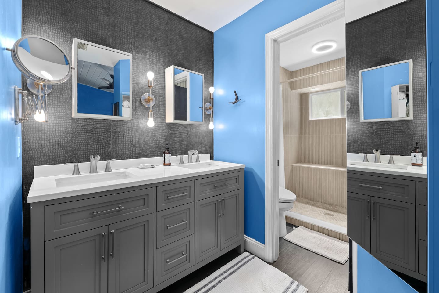 The primary bathroom features two sinks, a bidet and a large shower.
