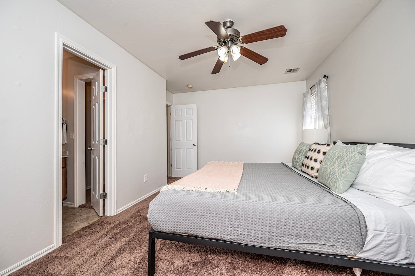 Unwind in your private retreat—master bedroom with a plush king bed.