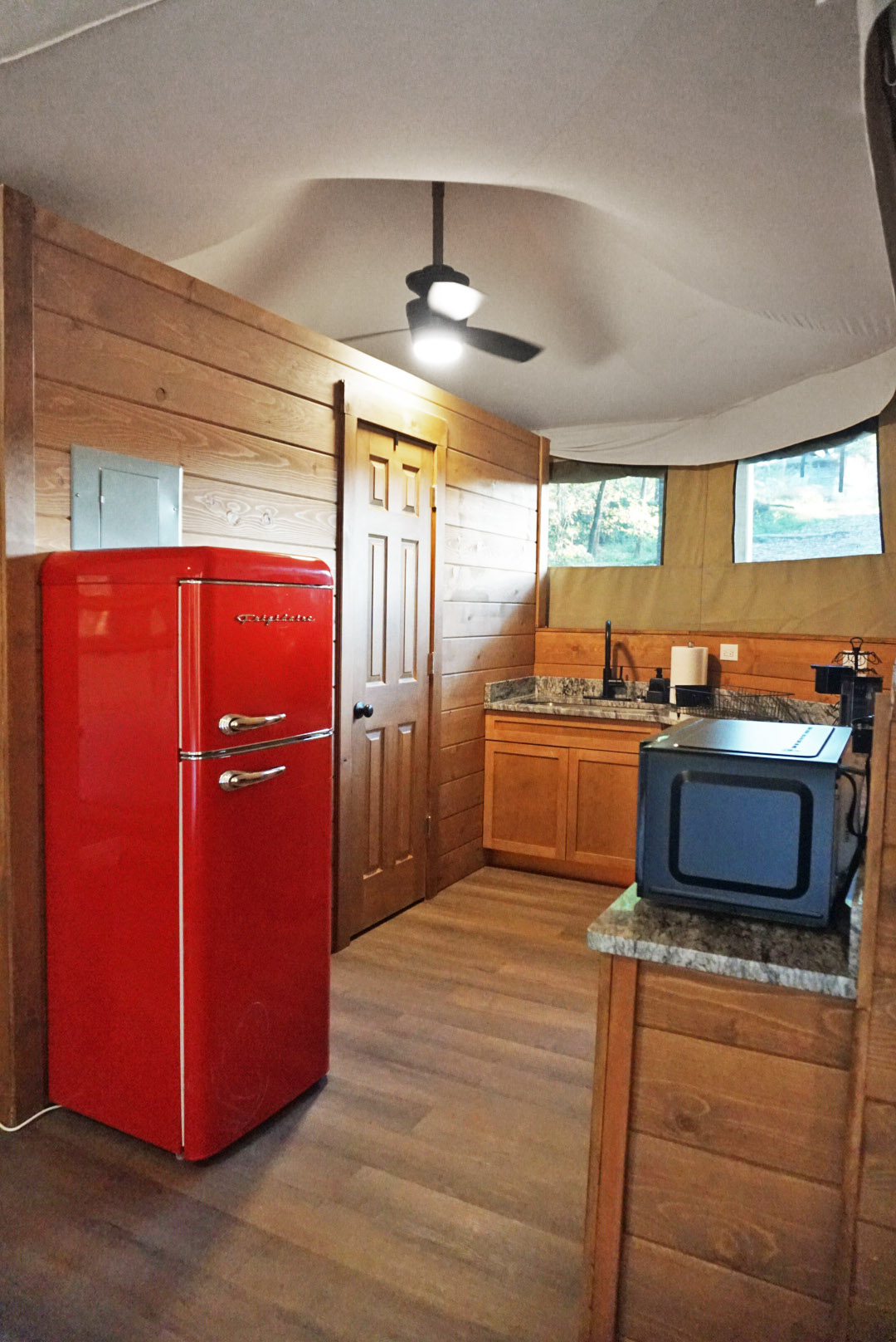 Vintage red fridge and wooden charm for your culinary adventures in nature!