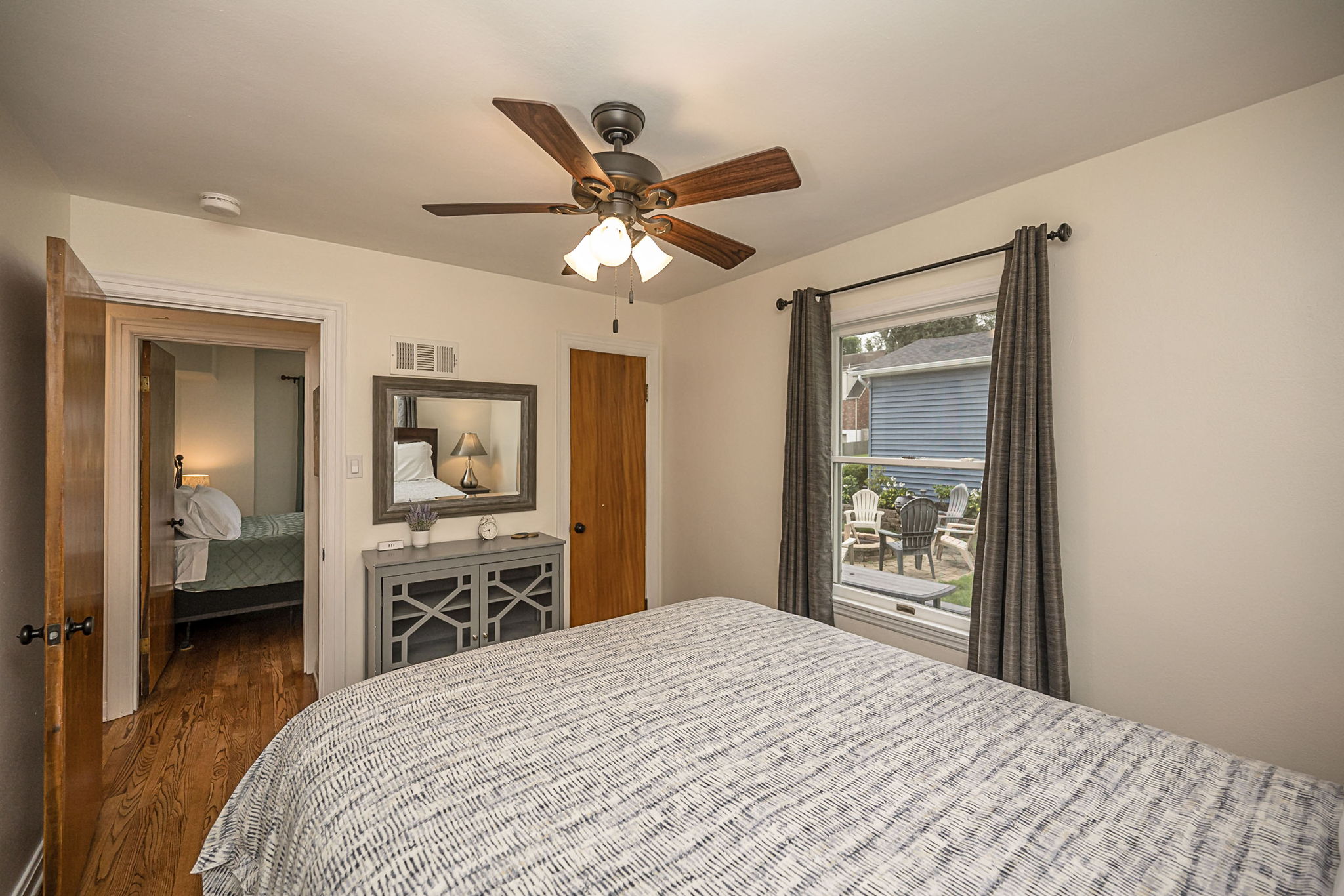 Relax in the queen bedroom with views of the backyard.