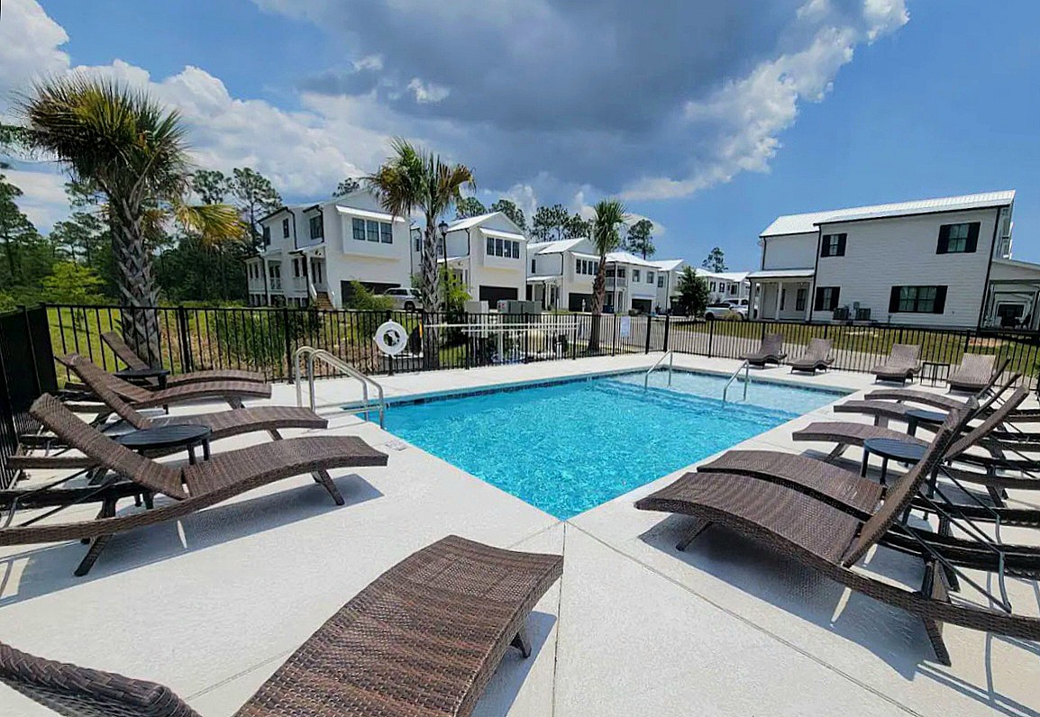 Community pool (non-heated) access for relaxing after a day at the beach 