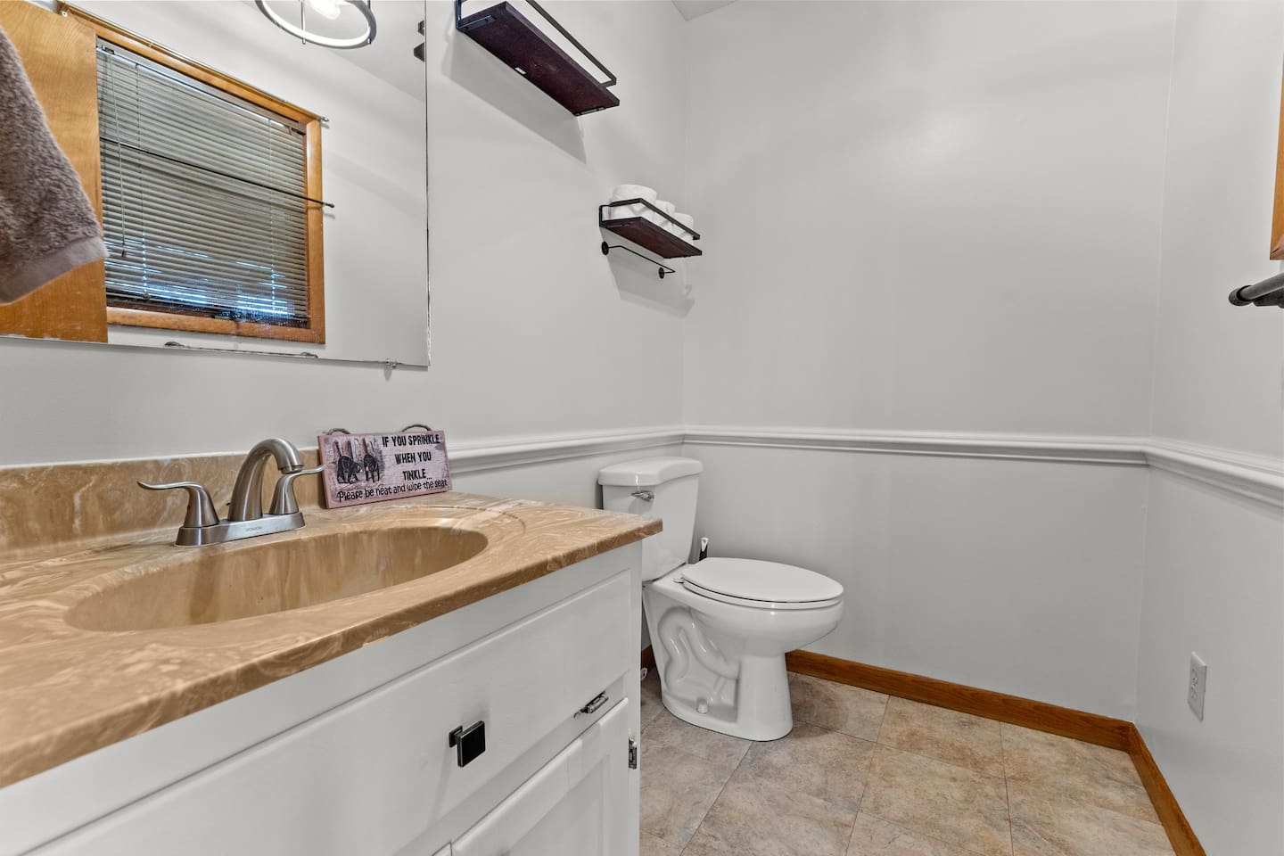 Bathroom Oasis: Bright space with stylish fixtures and charming details for your refreshing retreat!