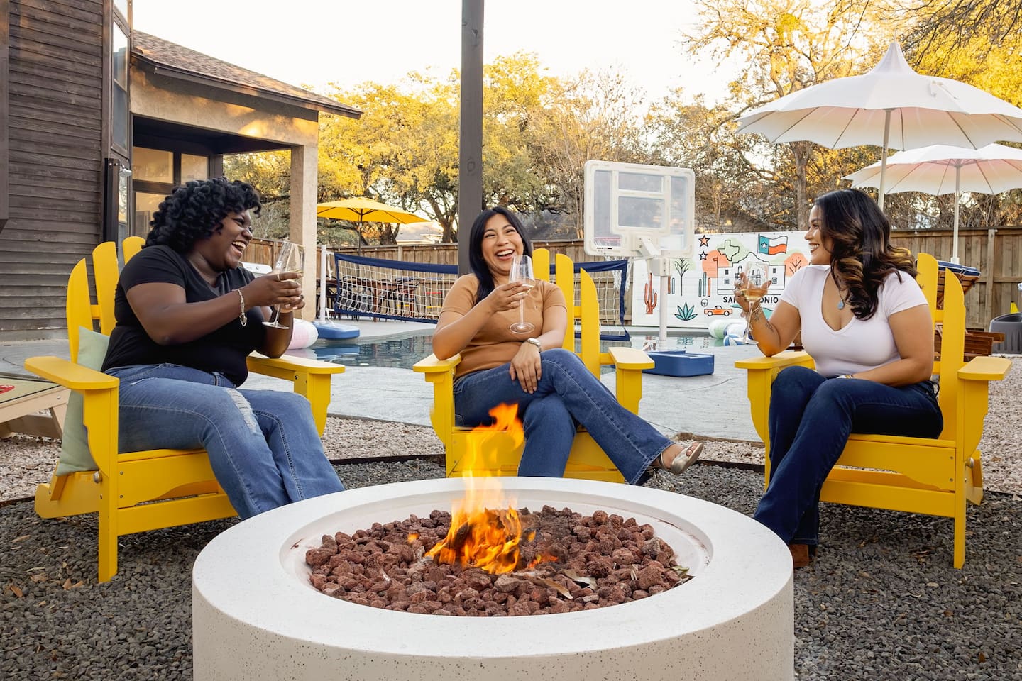 Wine, laughter, and firelight vibes  — the perfect way to unwind with your crew in our backyard oasis.