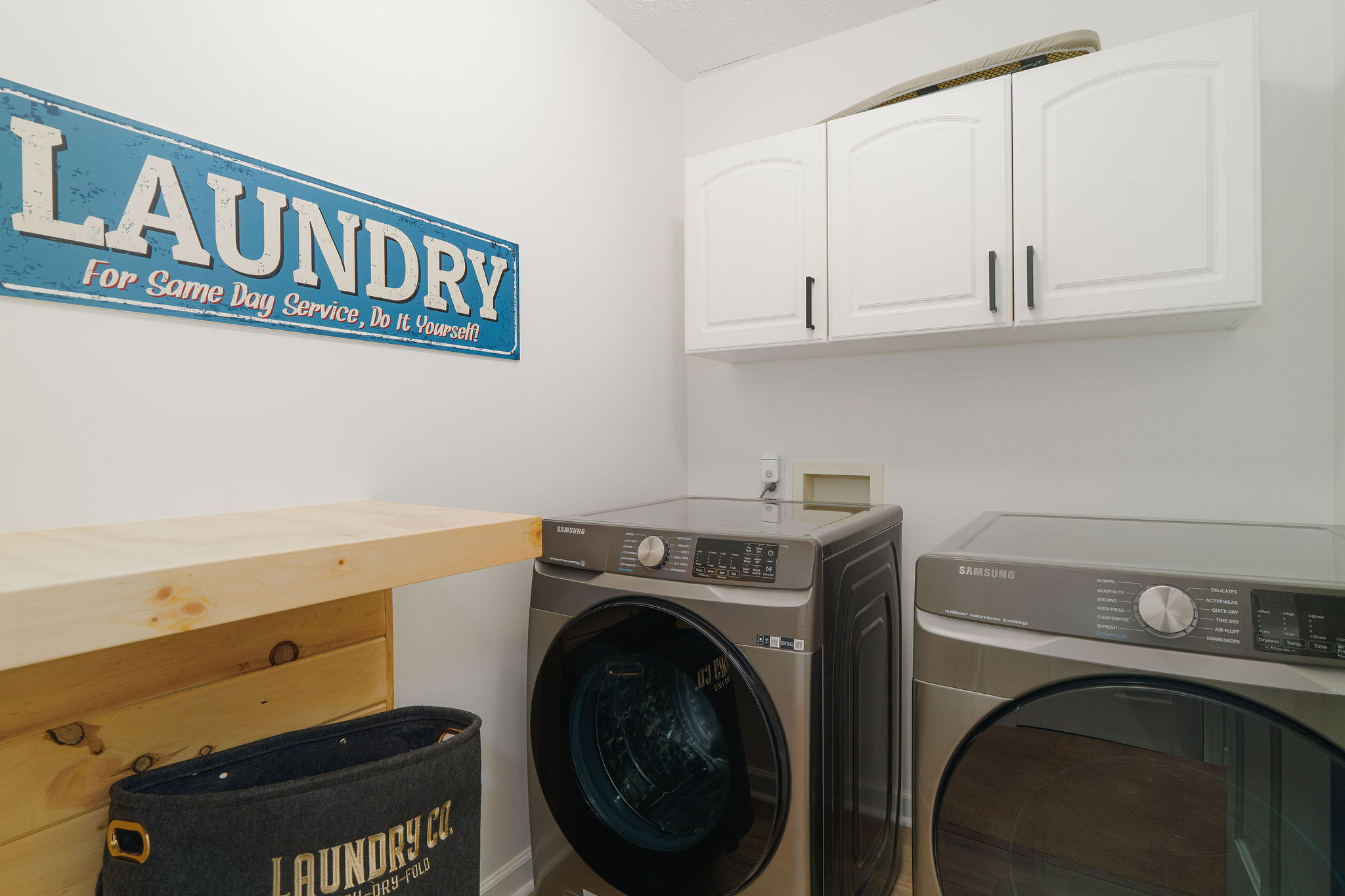 Full laundry room with modern washer and dryer for guest use