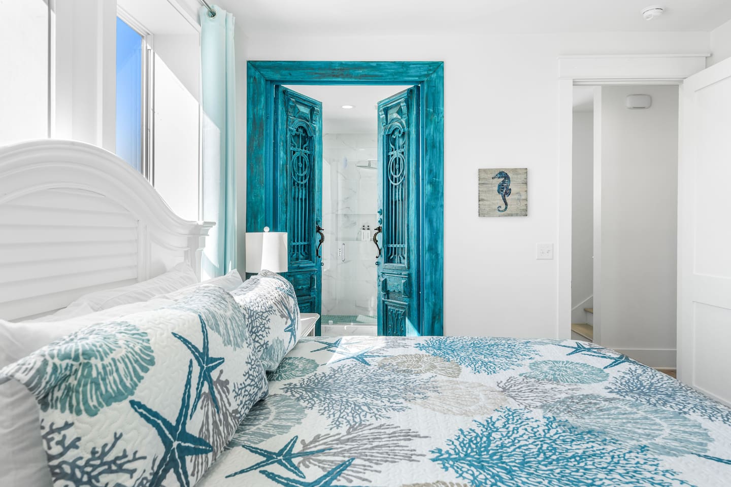 Luxury King Master: 200-year-old Antique French Doors meet modern tech. Enjoy an XL Smart TV, Supersonic fan, and a color-changing LED water shower & faucet. A bright, unique suite blending historic European charm with high-tech comfort.