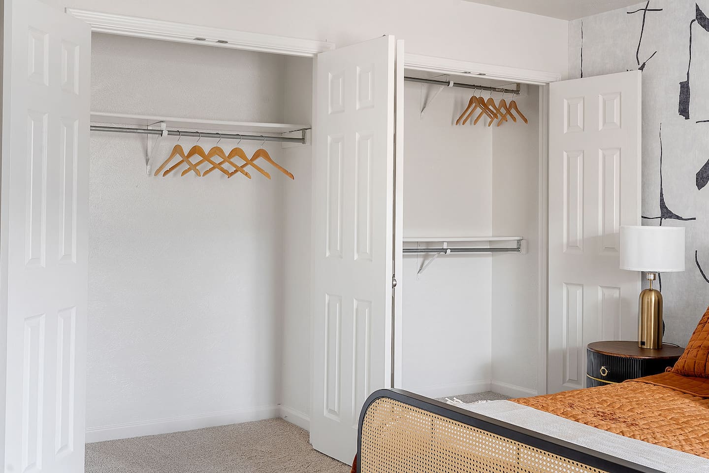 Organize your wardrobe in these spacious closets, equipped with ample hanging space and wooden hangers. 