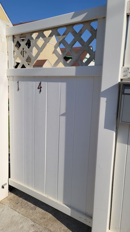 Enter this gate to the property, first house on the right. 