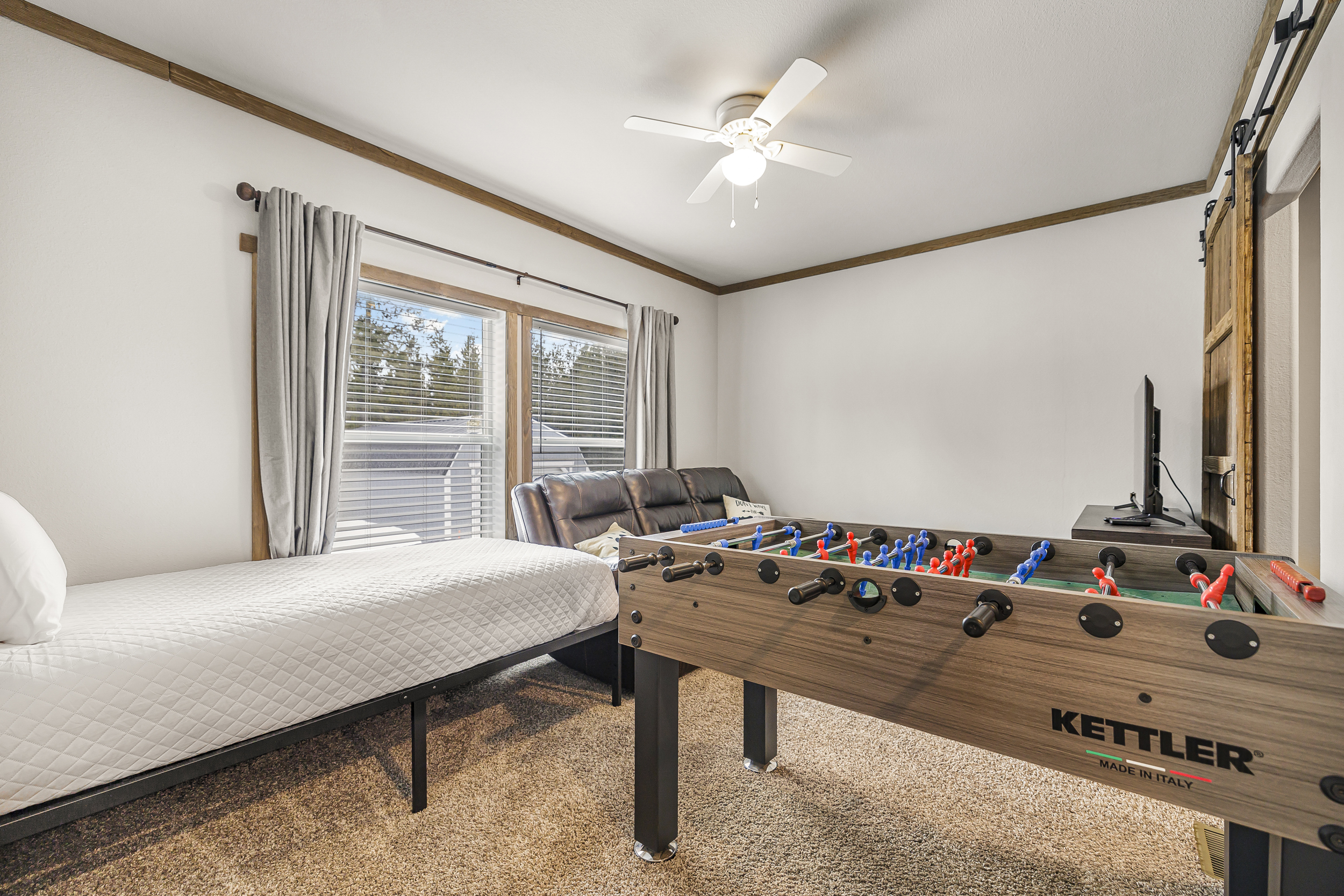 Family Room with TV, Foosball Table and additional twin bed