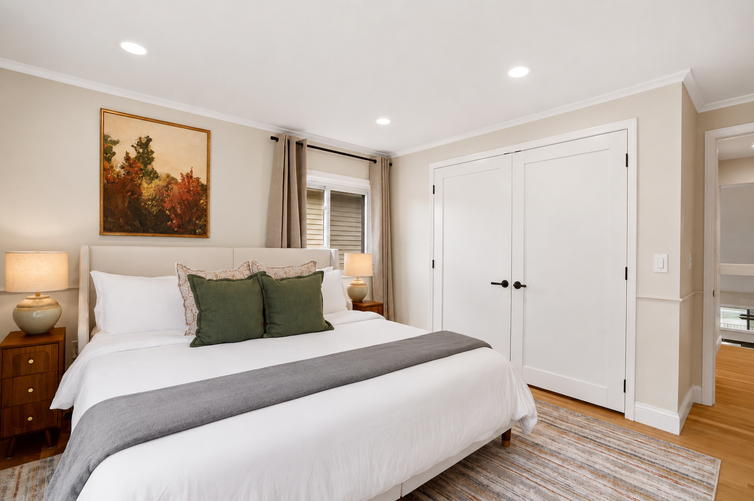 Bright and cozy bedroom with a king bed, soft neutral décor, and warm natural lighting. Clean, comfortable space designed for a restful and relaxing stay.