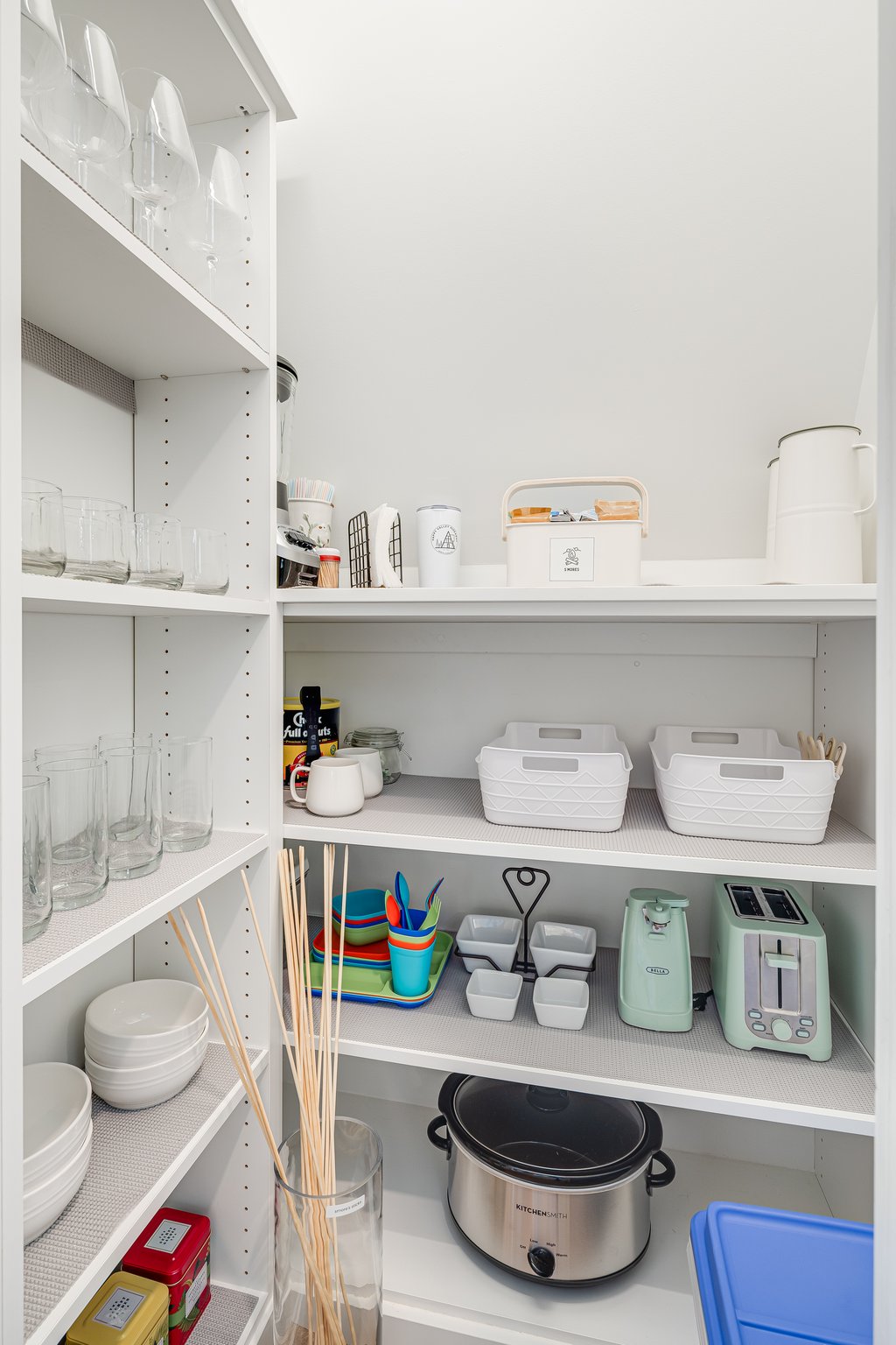 In the pantry you'll find glassware and a few staple appliances like a toaster, can opener and a crockpot. Also in the pantry child dishware and a complimentary started s'mores kit.