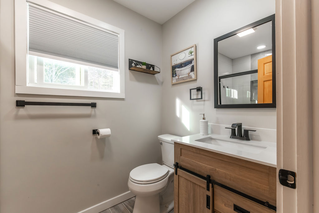 Main level bathroom, full bath with shower included! (Glass Tub and Glass Door)
