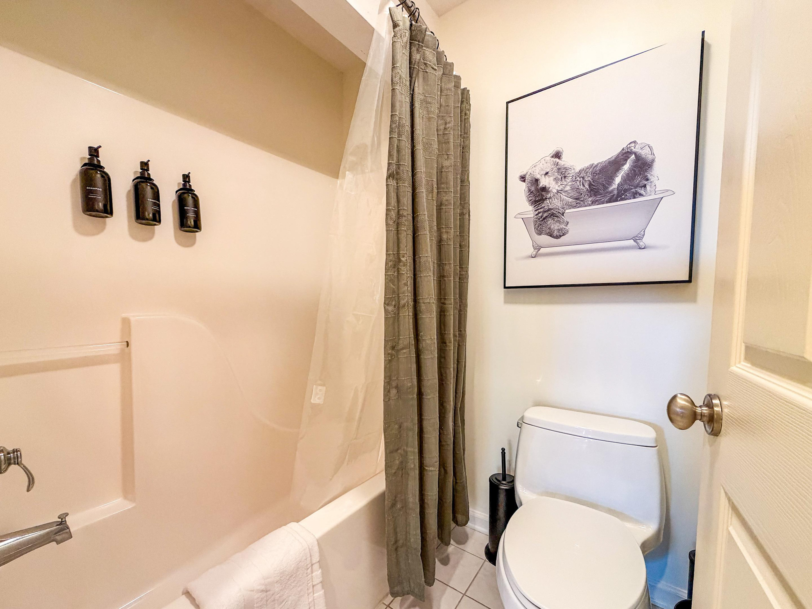 A combination tub/shower in the upper level bathroom. We proudly provide Paya organics body wash and shampoo for our guests.