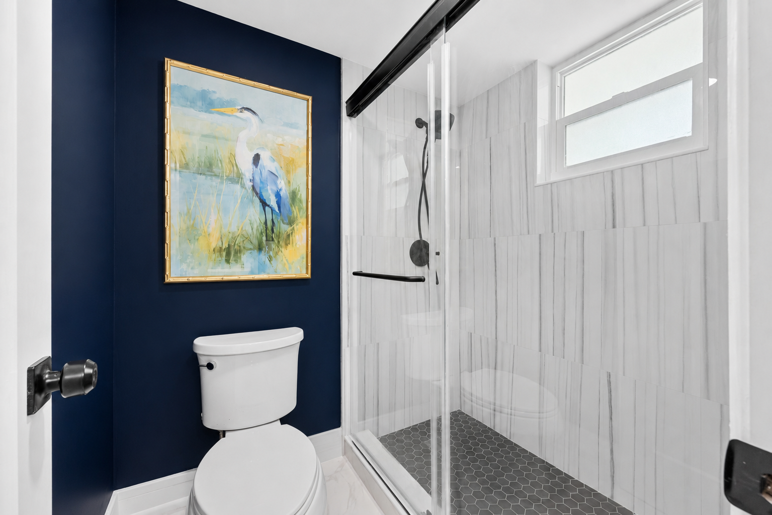 Private toilet room and walk-in shower.