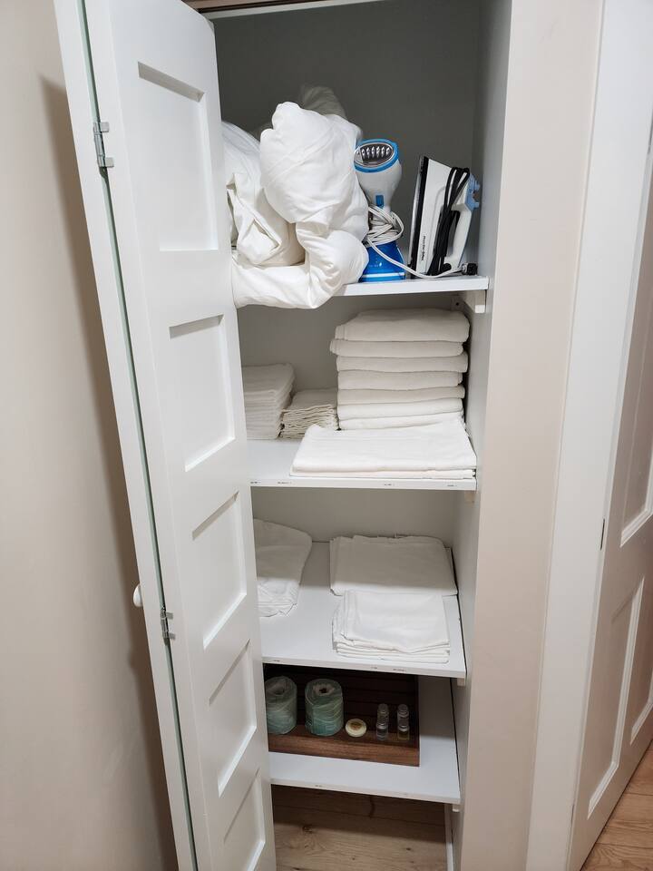 Fully stocked linen closet includes everything needed for the two downstairs bedrooms. Also includes extra sheets, pillowcases, blankets, toilet paper, soaps, shampoo, for you stay. 