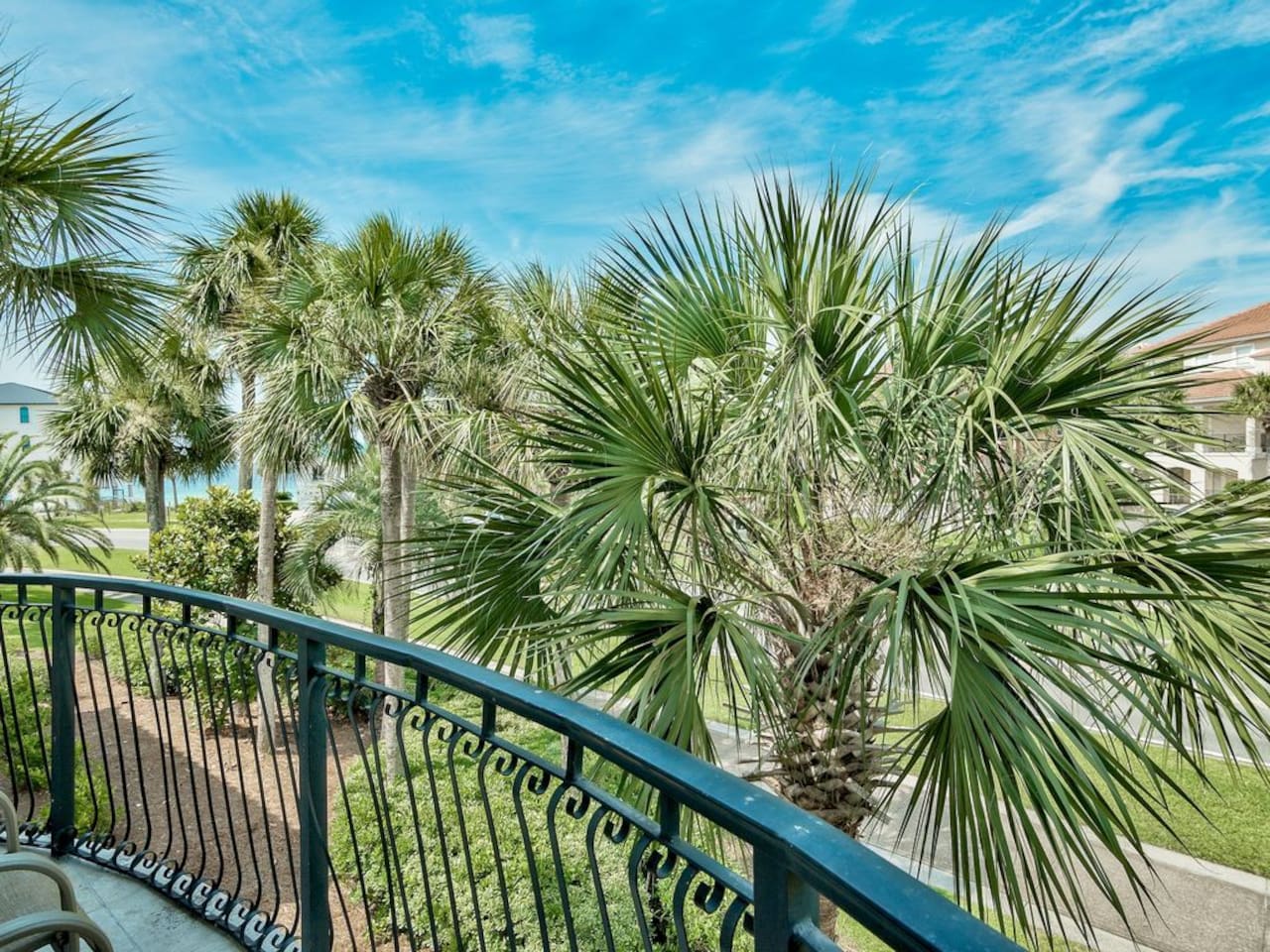 Primary suite with private side balcony and Gulf views