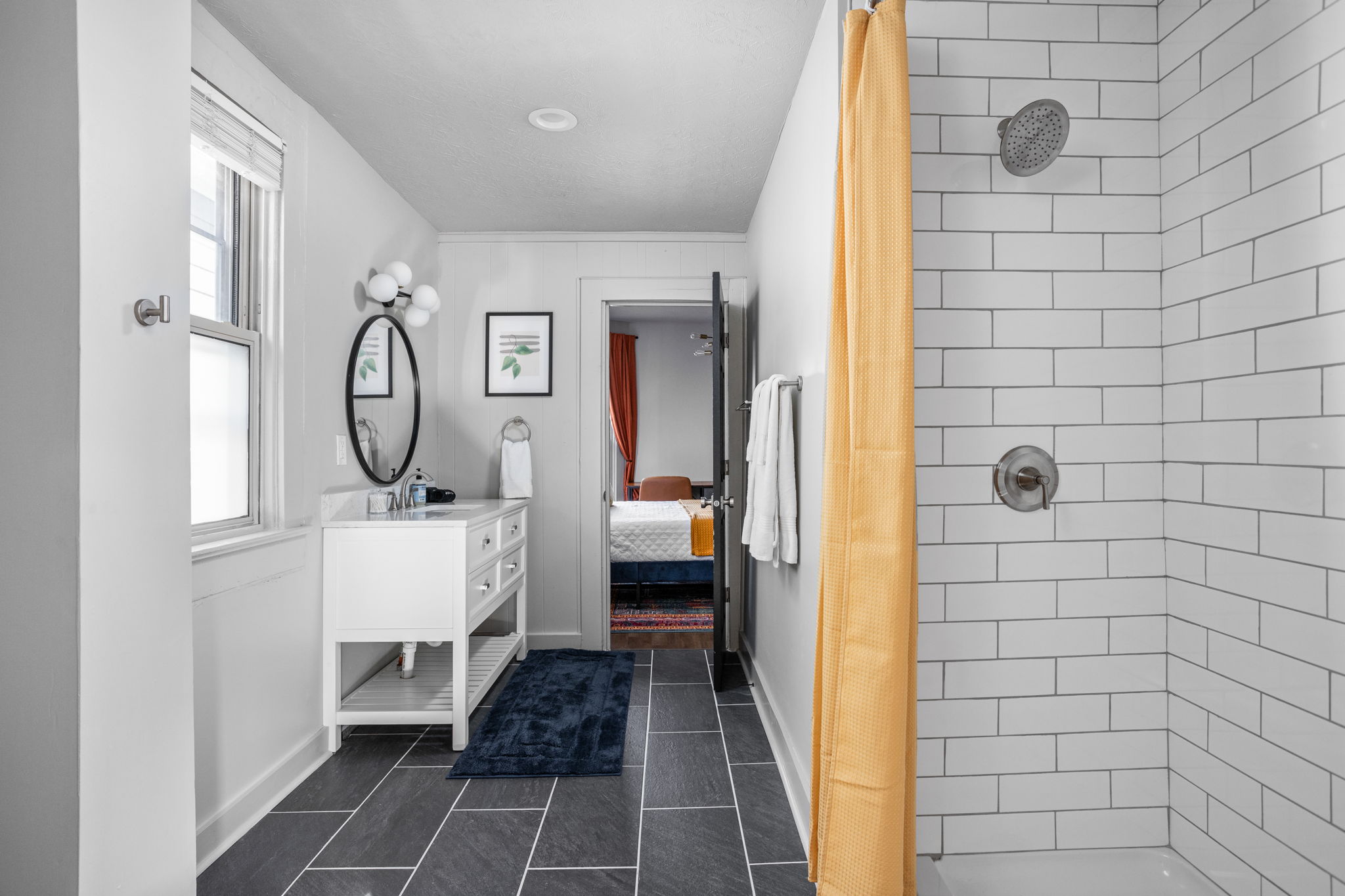Prepare and unwind in the primary en-suite bathroom.