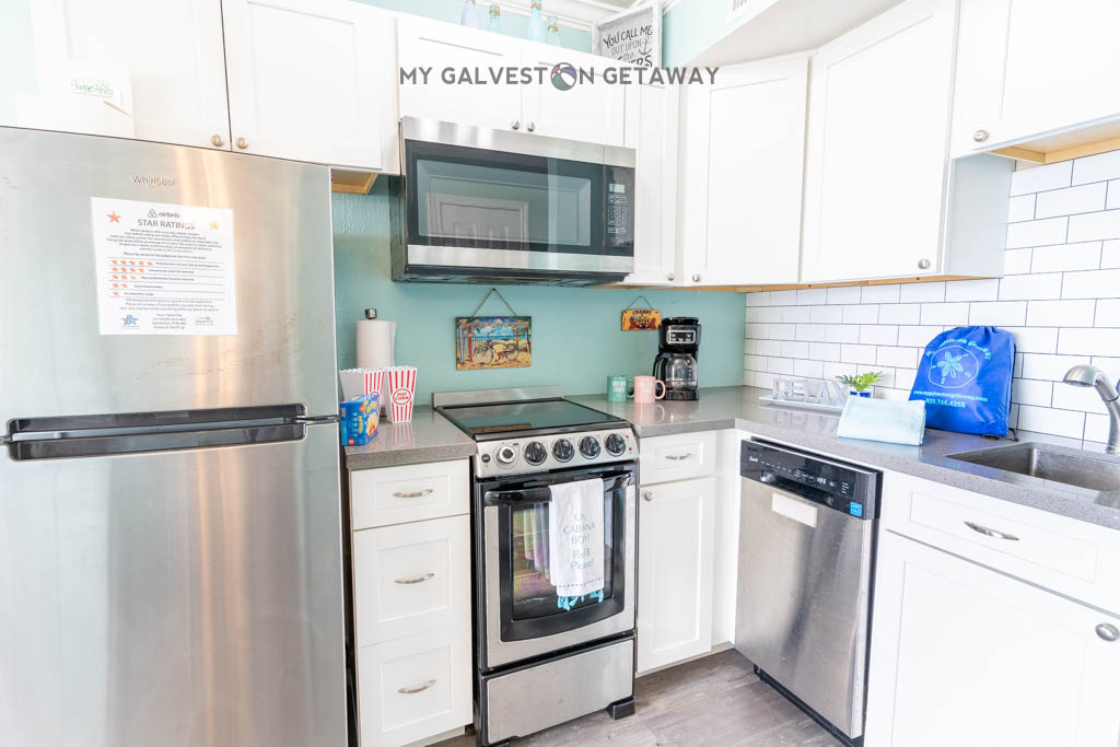 Then the kitchen with everything needed for midnight snacks or a full meal - it's not common to find a range in a condo at this complex