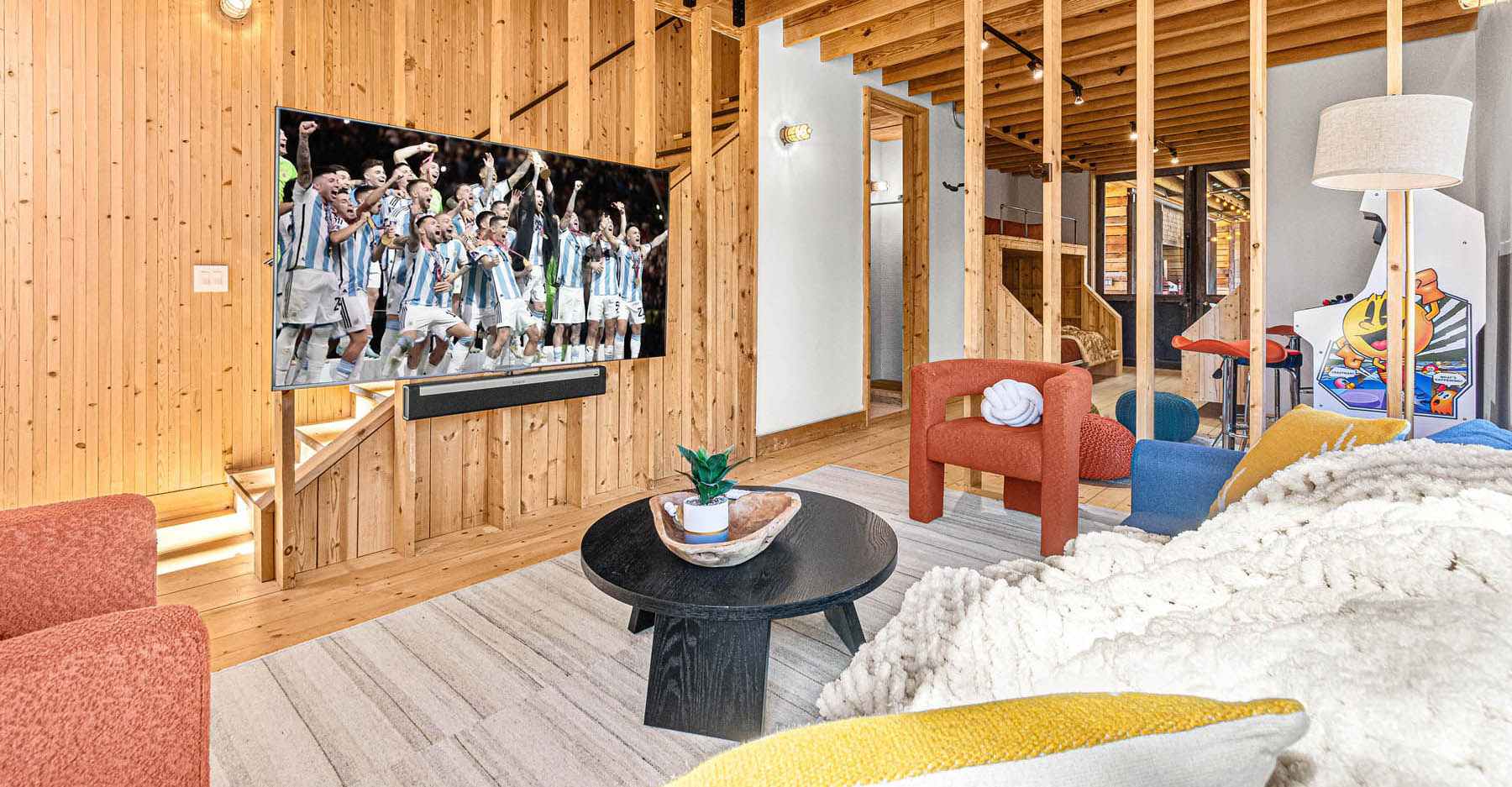 Watch your favorite sports in the main level rec room featuring a 75" smart TV with a Sonos sound bar and a sleeper couch for twp