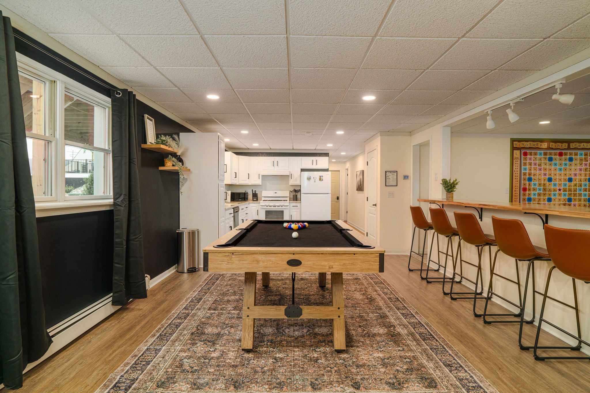Spacious Basement Game Lounge Enjoy a full slate of entertainment with billiards, bar seating, and a second fully stocked kitchen.