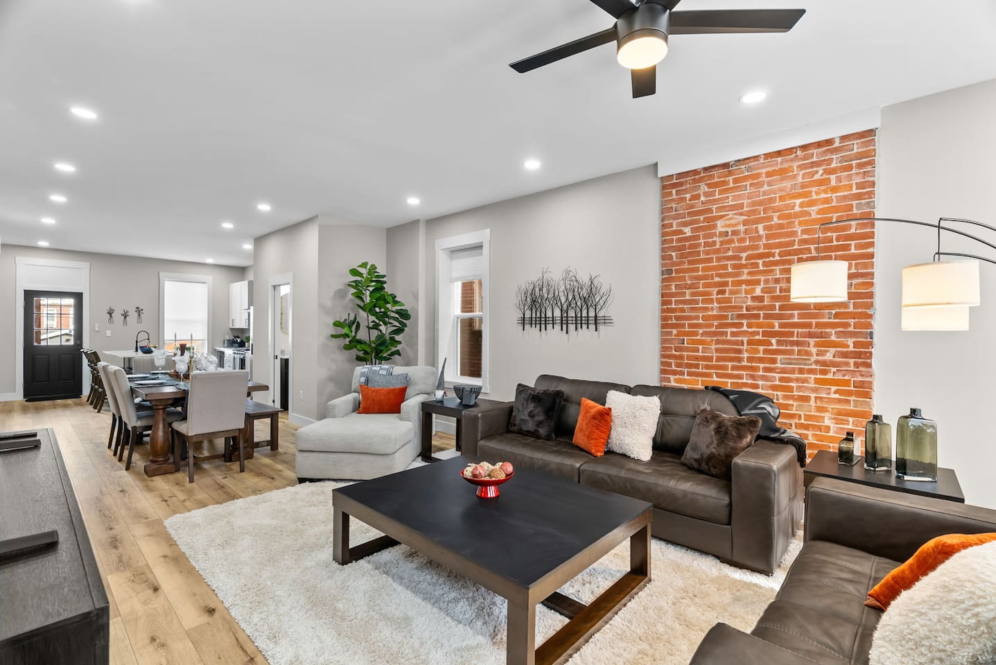 The home boasts a spacious open-concept design with high ceilings, creating a bright and airy atmosphere.