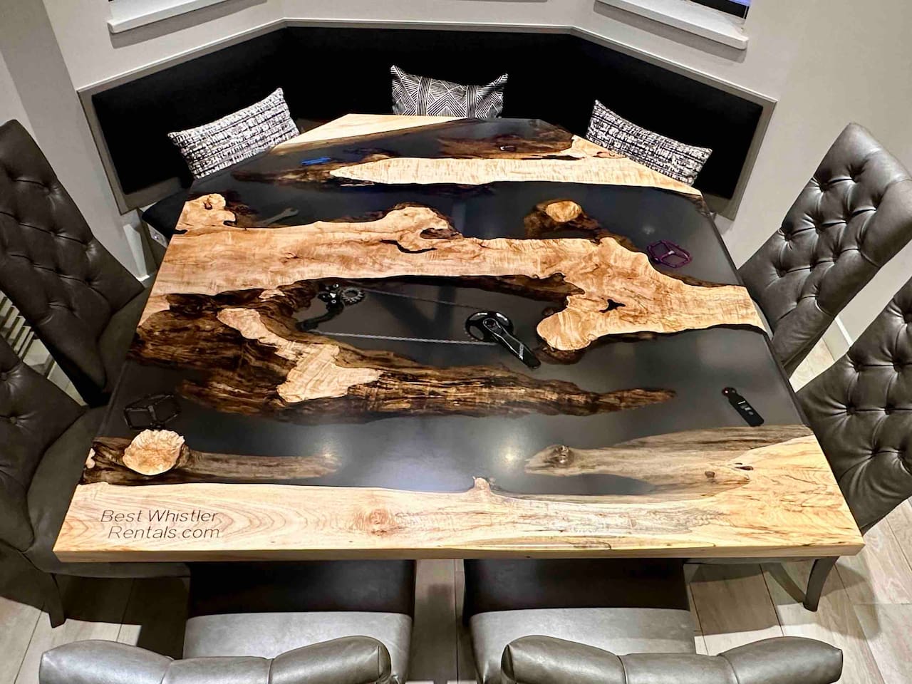 Maple Wood table with clear epoxy veins to accentuate the live edge natural contours of the tree. Spare parts from Derek’s retired mtn bikes found their way into the epoxy during the build.