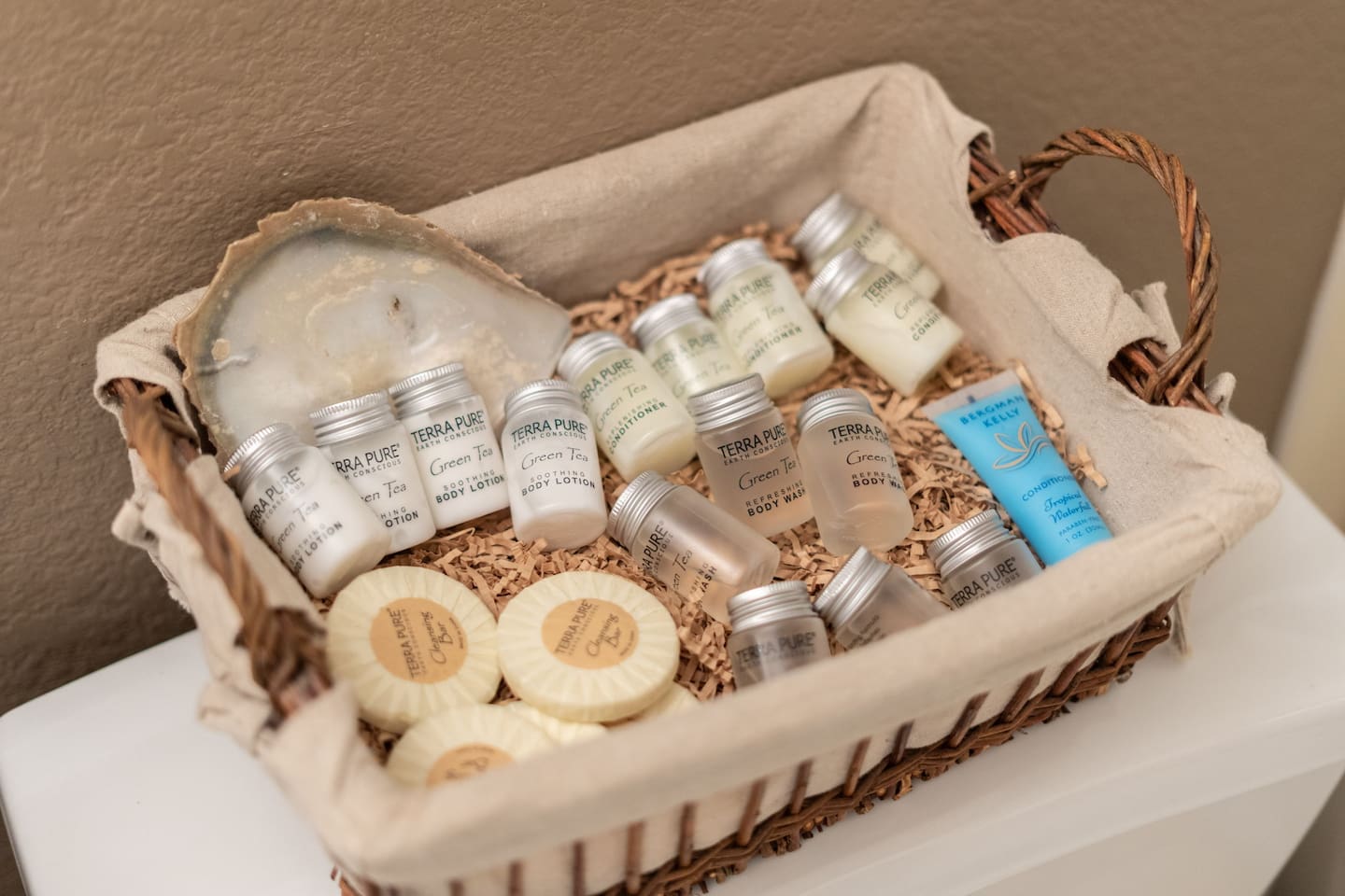A curated welcome basket of Terra Pure toiletries — shampoo, conditioner, body lotion, soap, and more — means you can pack light and still feel pampered from day one.