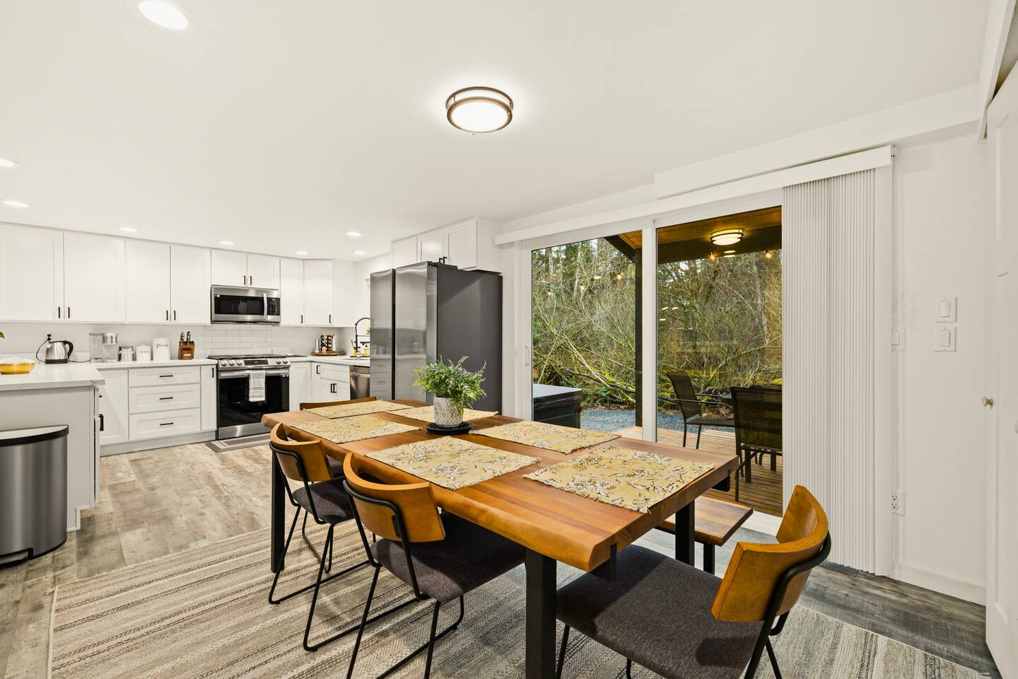 Step into the serene backyard from the dining area