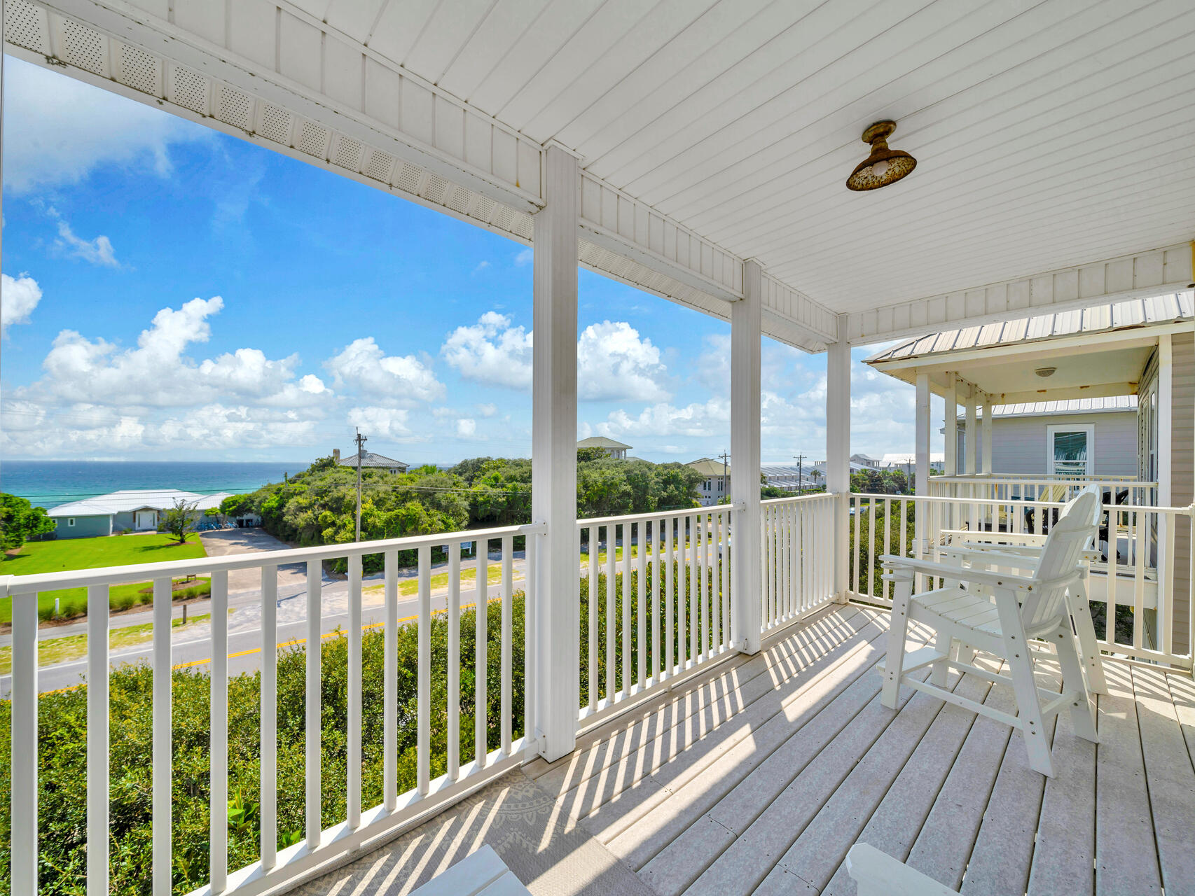 Soak in the gulf breezes and enjoy gorgeous sunsets from this private balcony off the third-floor primary suite