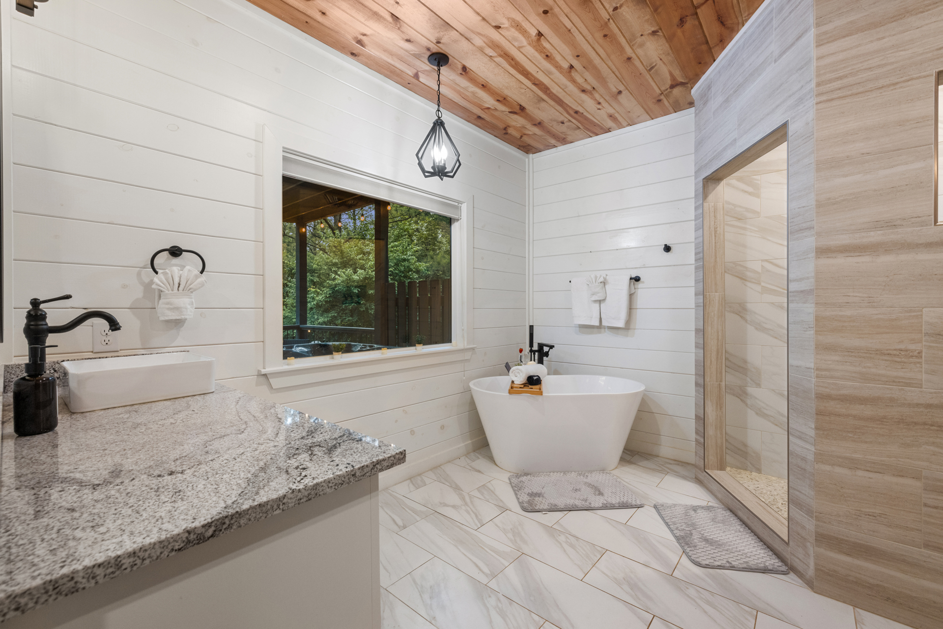 A king suite ensuite bathroom designed for relaxing beautifully. 
Featuring a soaking tub, spacious vanity, and calming spa inspired details that make unwinding feel effortless.