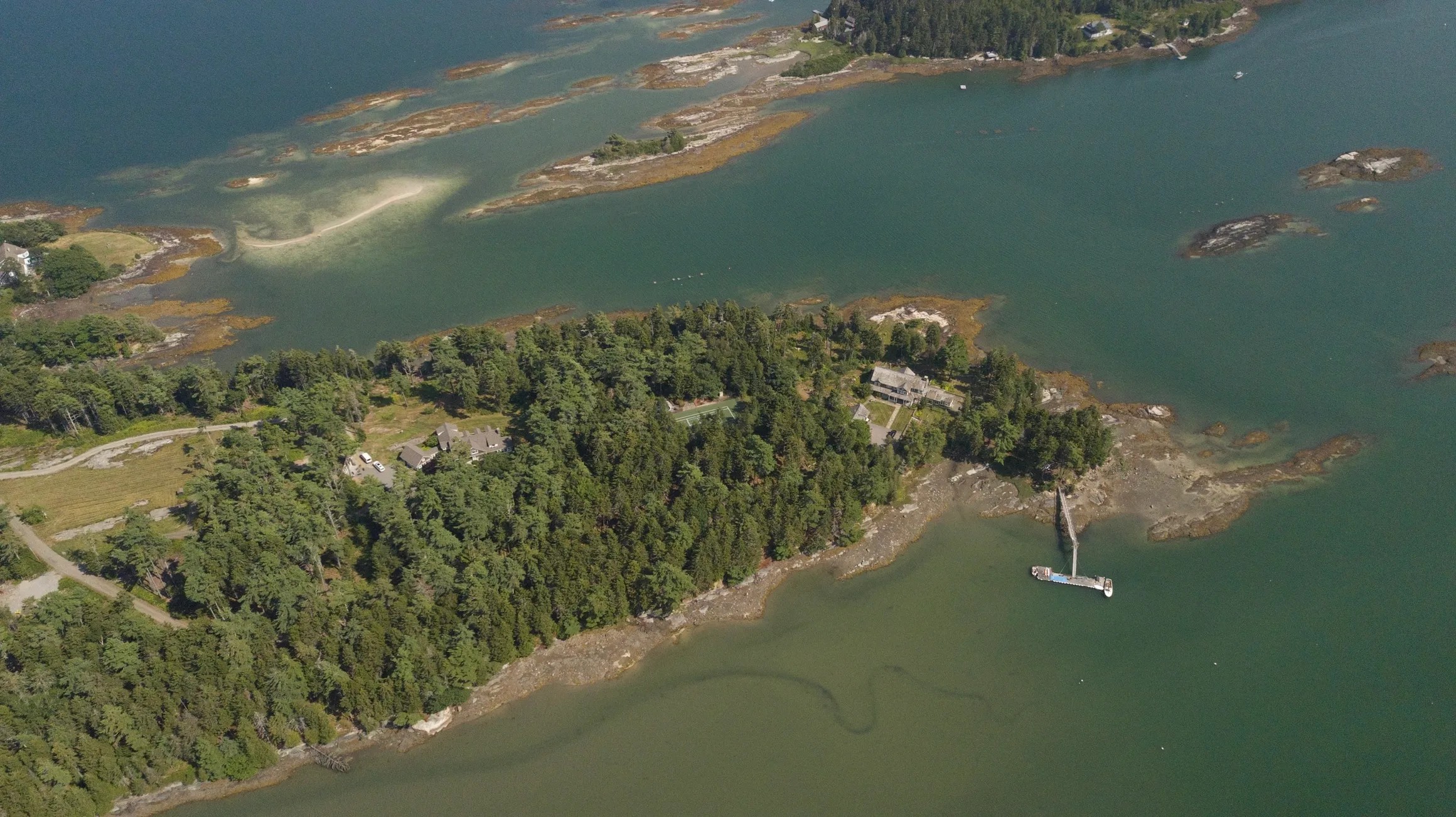 The Compound -The Maine House on the right, the Tennis Court in the middle, The Owner's residence on the left.