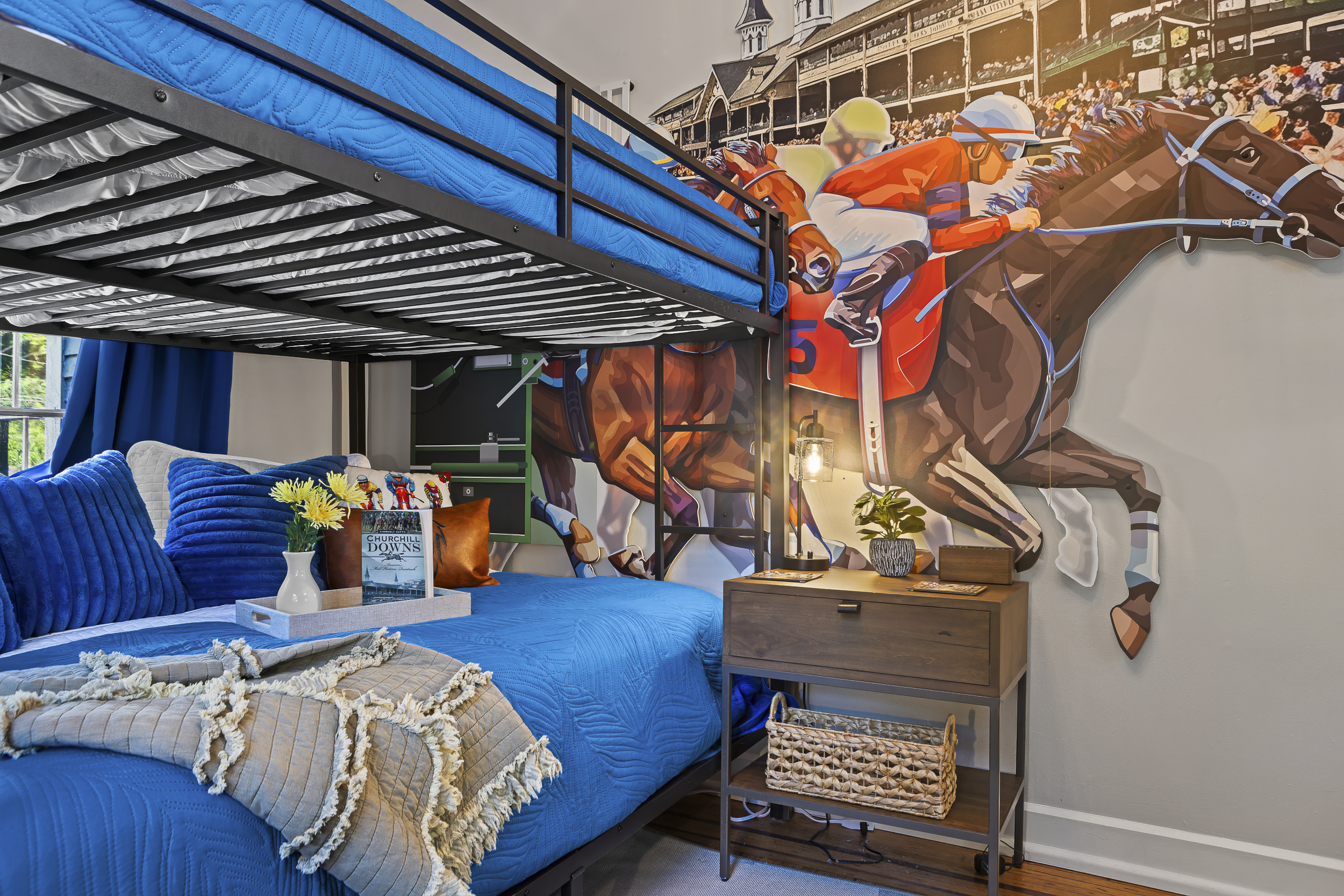 The Churchill Downs mural stretches wall to wall. A legendary backdrop for your group's most adventurous sleepers.
