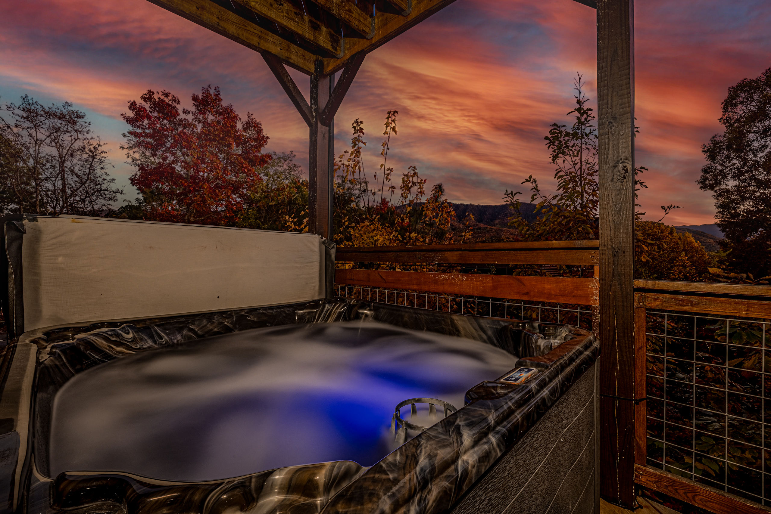 Soak in the hot tub at sunset with sweeping Smoky Mountain views.