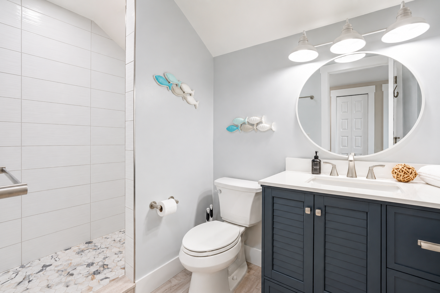 Complete with a spacious walk-in shower, vanity, and all the essentials, this private bathroom makes the third-floor retreat ideal for families, kids, or larger groups sharing the space.