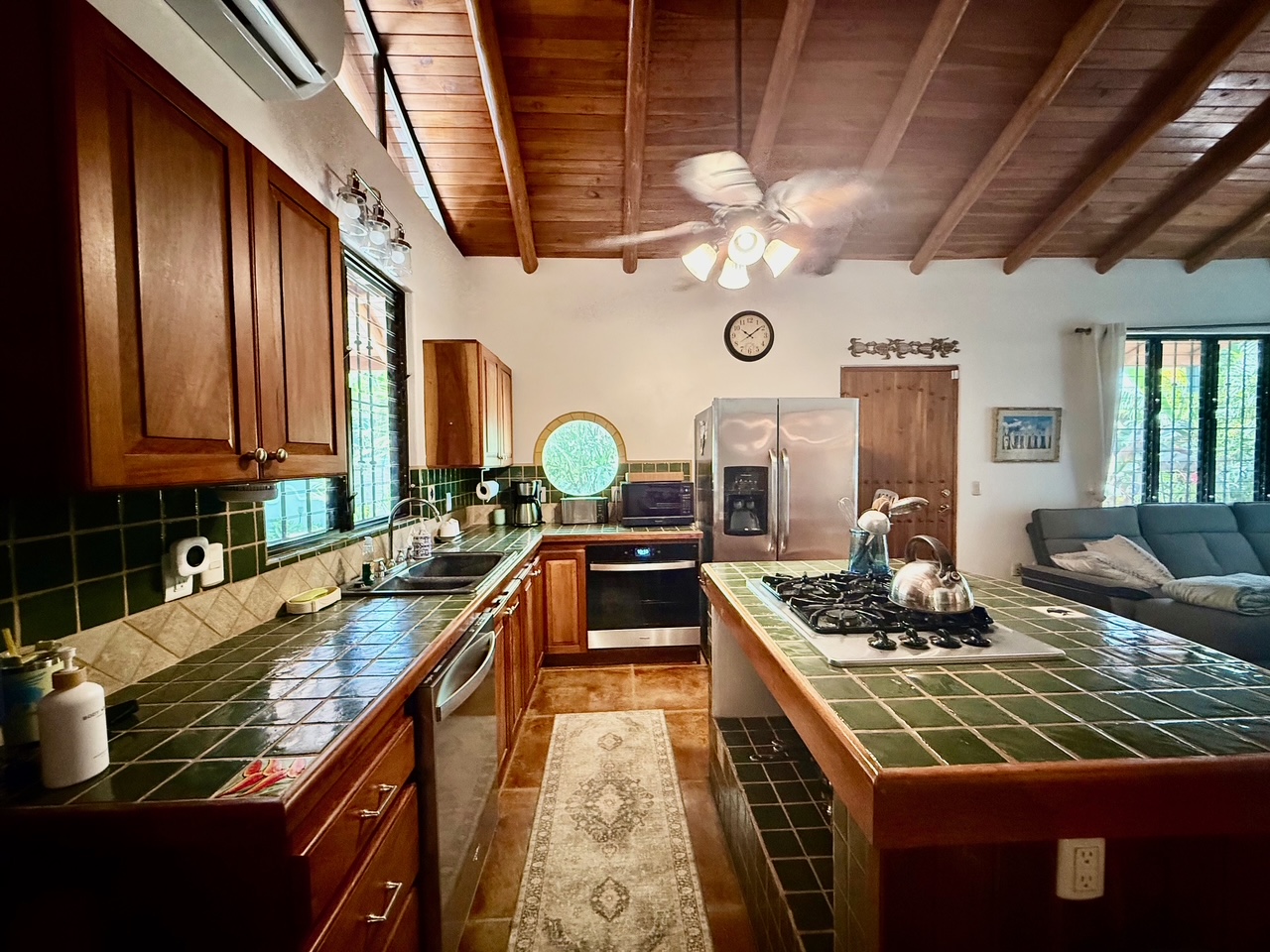 Fully stocked kitchen with dishwasher, disposal, oven, and gas rangetop
