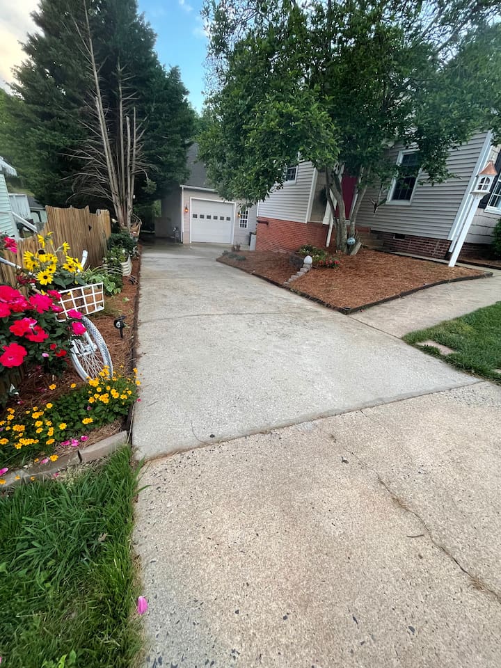 Just walk down our driveway and the entrance is to your right under the new deck. 