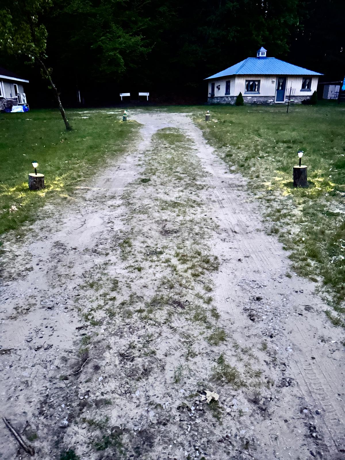 Follow the softly lit path through the trees to reach your cozy retreat at The Duet Cottage.