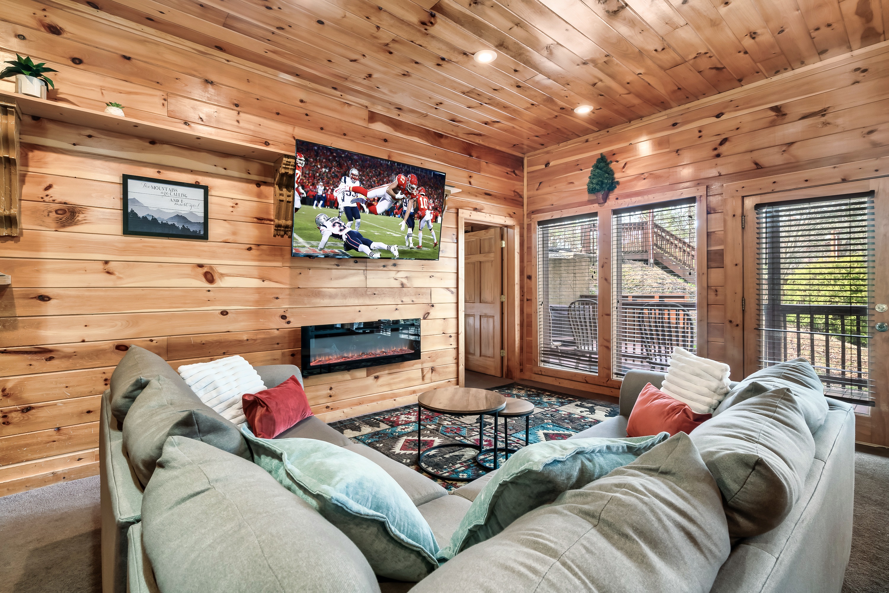 Cozy up by the fire in a living room made for shared stories, movie nights, and quality time together.