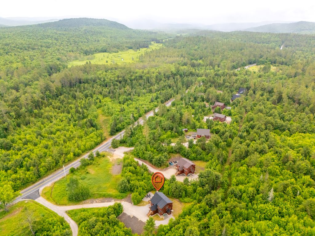 A cozy community where neighbors wave from winding driveways and forest trails!