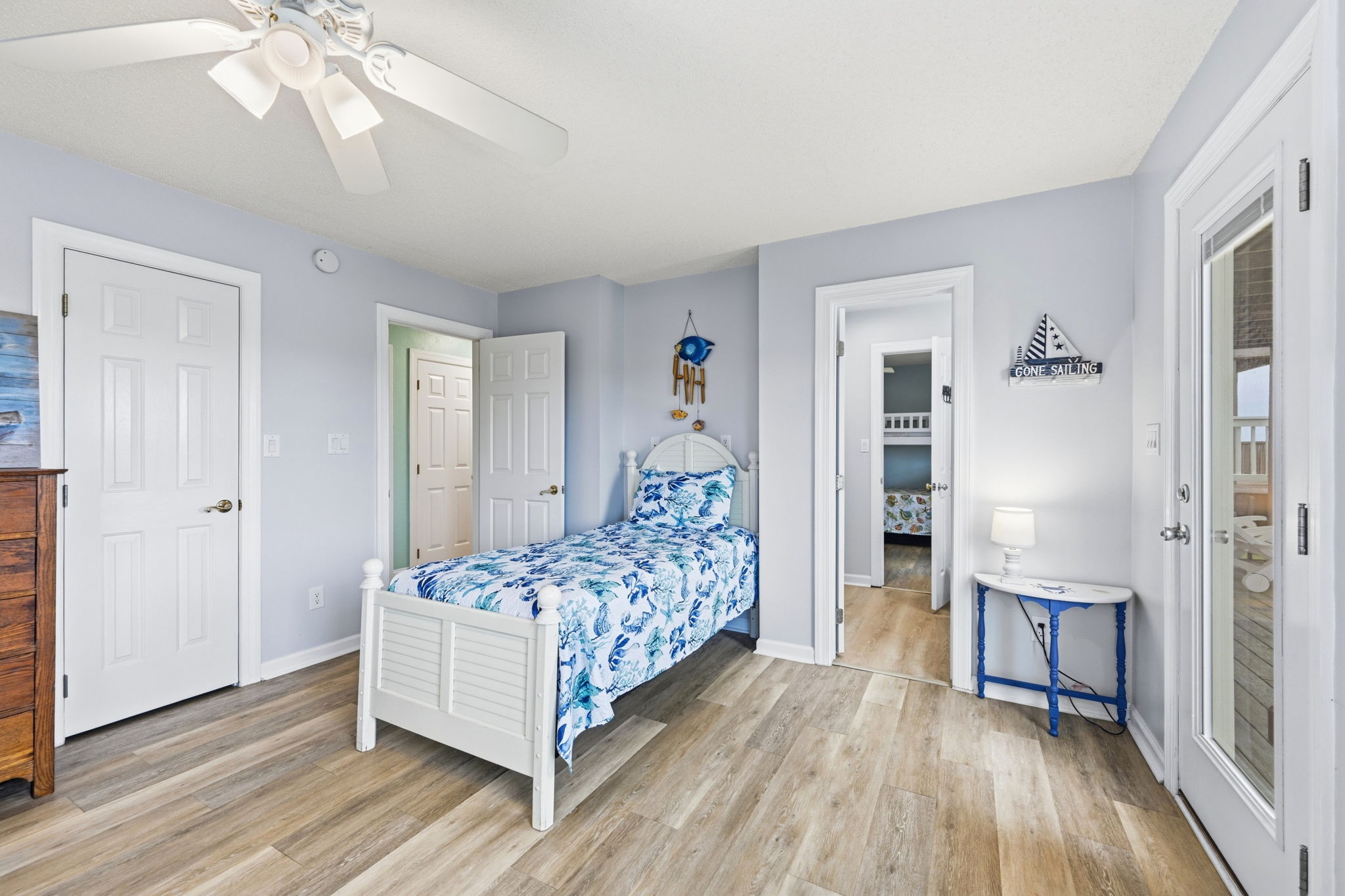 A cozy twin bed and a jack and Jill bathroom makes this bunk room even more accommodating