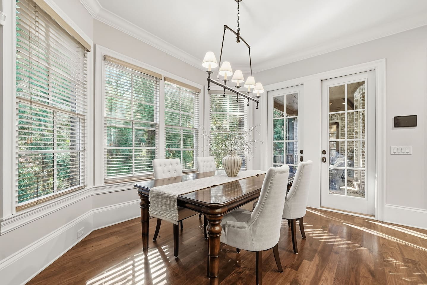 Cozy breakfast nook just off the kitchen, seating four comfortably. A warm, intimate space perfect for casual meals, morning coffee, or relaxed conversations.