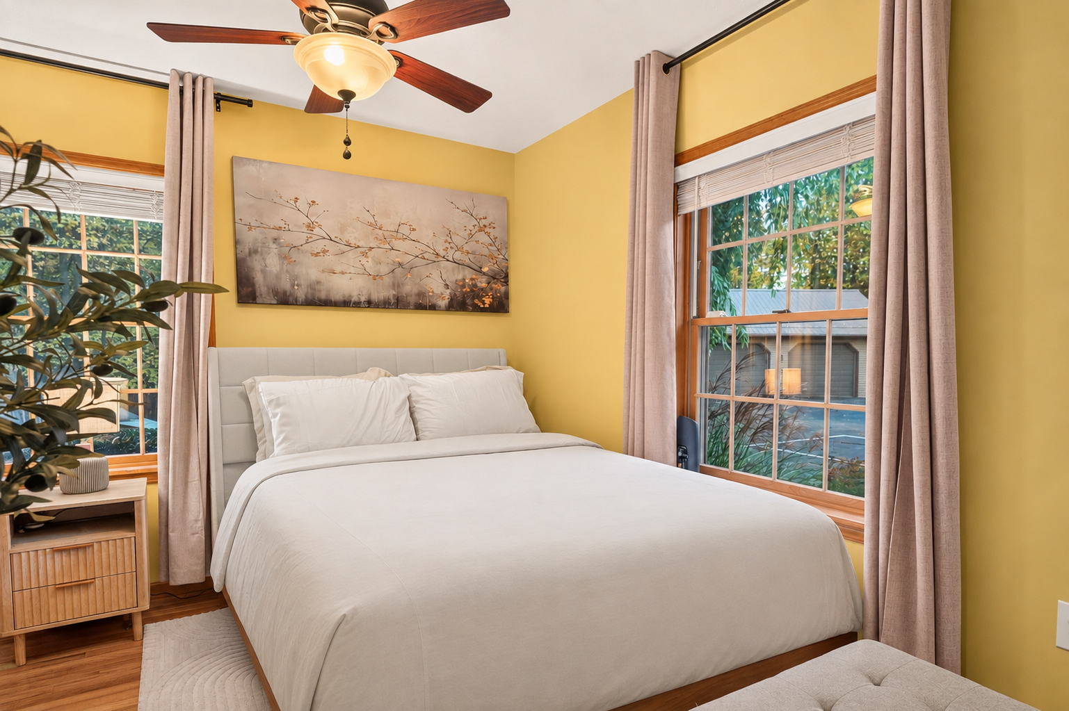Bedroom 1 with white bedding and yellow walls