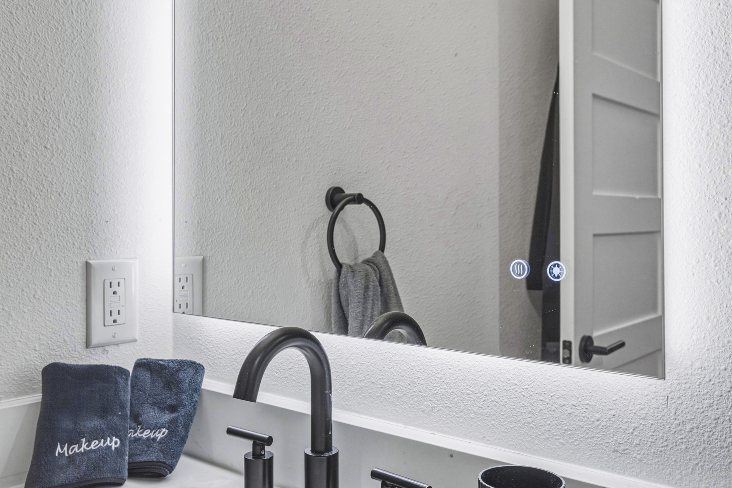 Enjoy modern fixtures and chic towels for a refreshing experience!