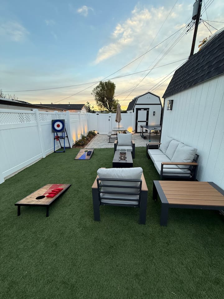Backyard Seating and Fire Table. Outdoor Dining Table. Games: Ping Pong Table, Corn hole, Ax Throwing