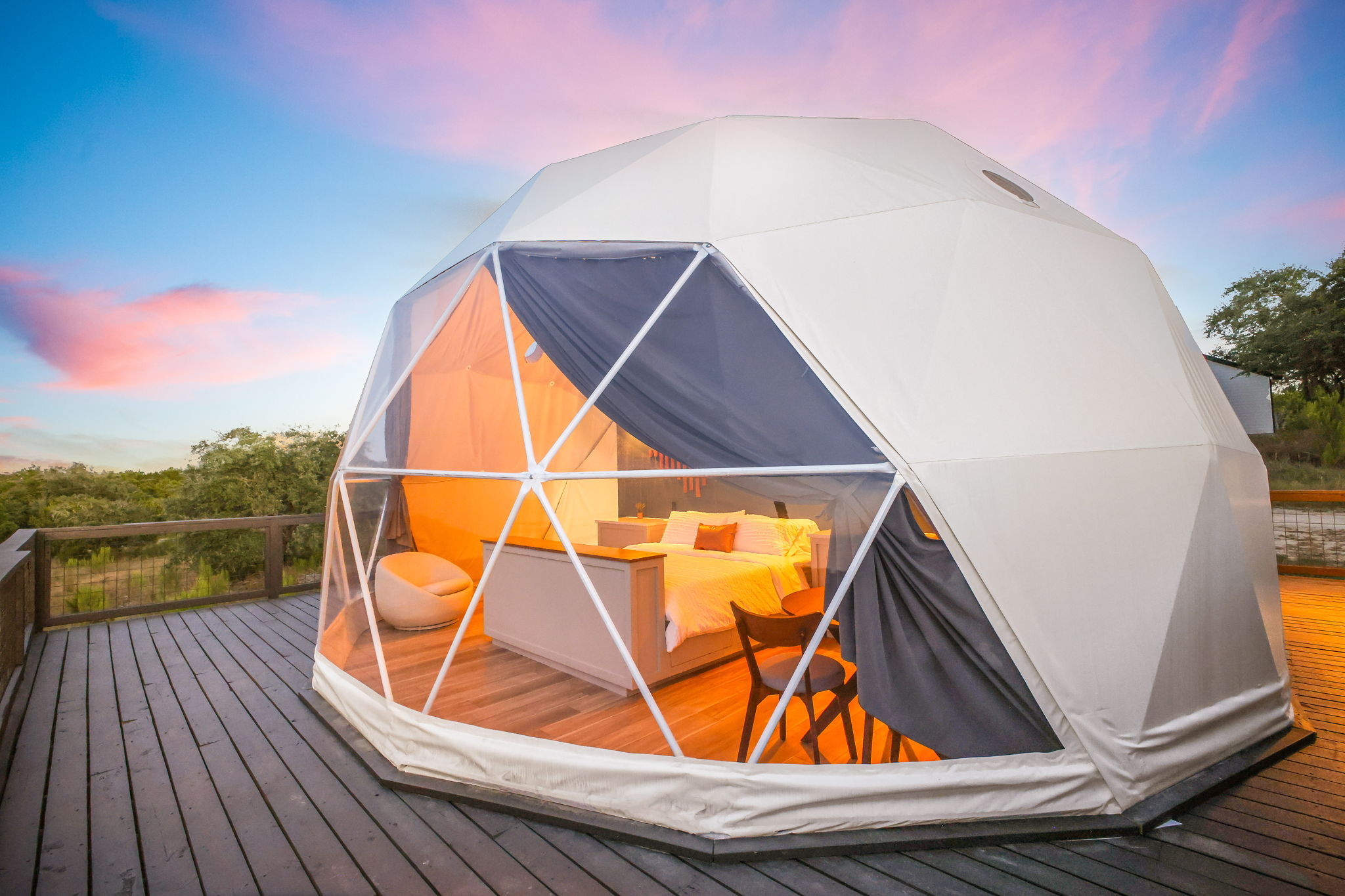 Catch the morning sun rising over the Texas Hill Country, reflecting off your private geodesic dome retreat.