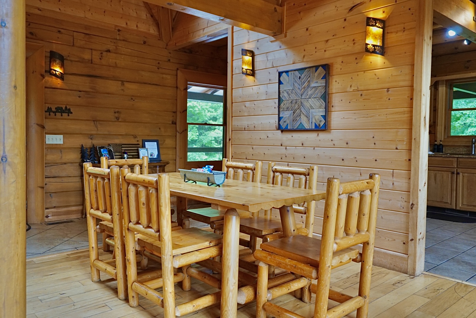 Dining Area: Gather around the rustic table, surrounded by natural wood and serene views!